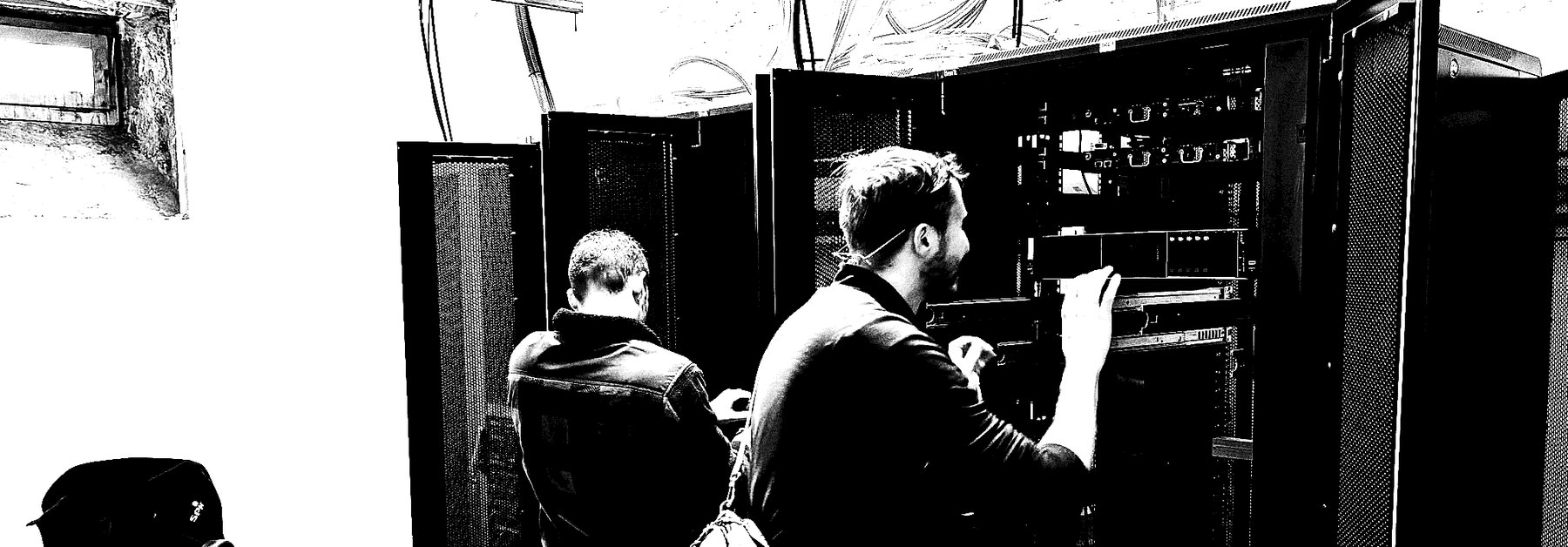 Working on racks in a server room.