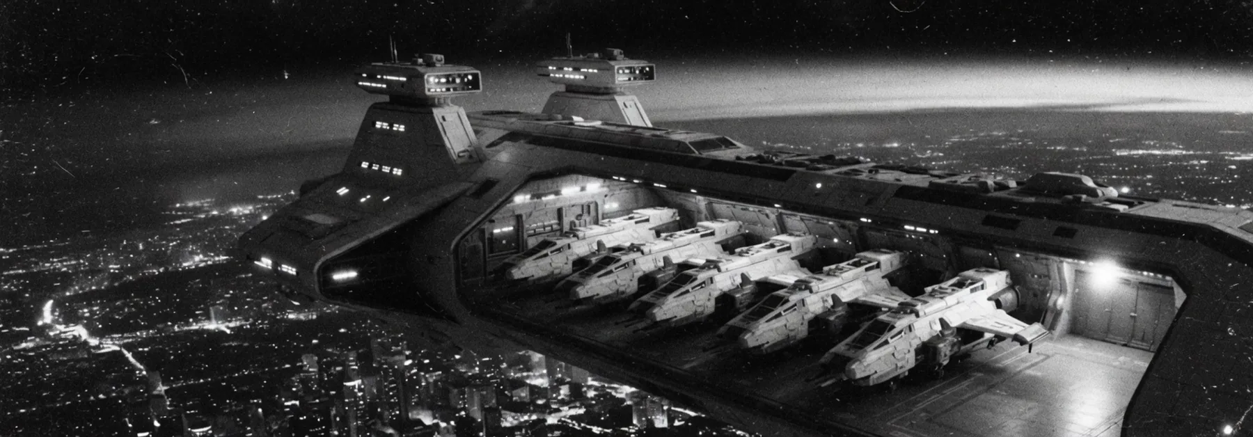 A cream cruiser hangar: a line of gunships and one empty bay.