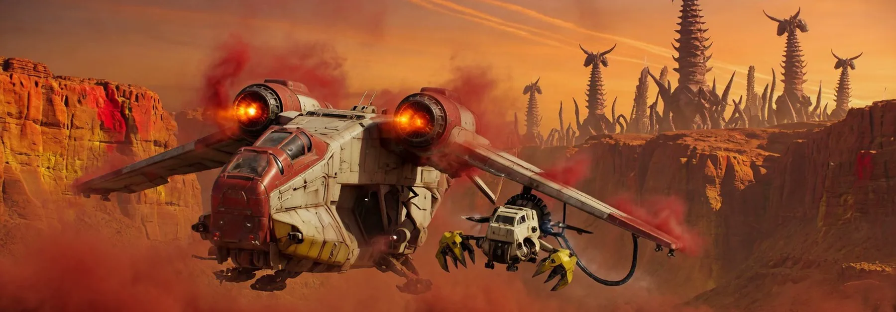 A gunship over an orange canyon with a scout clamped under the wing.
